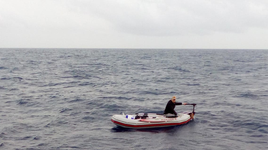 In this photo taken on Dec. 1, and made available on Dec. 4, 2017, a Syrian refugee is spotted in his 3-meter (10-foot) long rubber boat some 25 miles off Libya's coast by the NGO rescue boat of Proactiva Open Arms. The man, 30, who had set out solo in his tiny rubber boat trying to reach the Lampedusa Island, was rescued by the NGO boat. According to rescuers he was suffering from shock. (Proactiva Open Arms/via AP Photo)