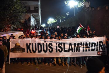 Protesters hold a banner reading “Jerusalem belongs to Islam” during a demonstration in front of the US consulate in Istanbul on December 6, 2017. (AFP)