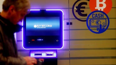 A man walks past a bitcoin ATM in Vilnius, Lithuania, on December 6, 2017. (Reuters)