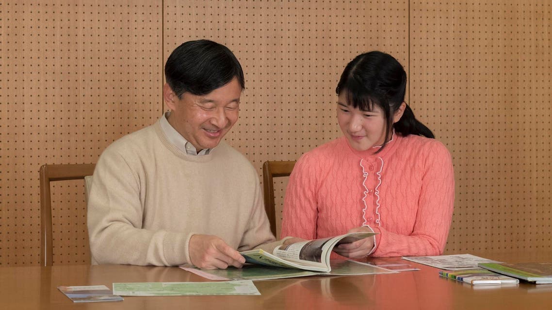 Japan’s Princess Aiko (R) with her father Crown Prince Naruhito in this photo taken on November 23, 2017. (AFP)