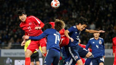 North Korea’s Jong Il Gwan and Japan’s Junya Ito and Mu Kanazaki in action during  the East Asian Football Championship in Tokyo on December 9, 2017.  (Reuters) 