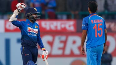 Sri Lanka’s Niroshan Dickwella, left, celebrates their win over India in the first one-day international cricket match in Dharmsala, India, on Dec. 10, 2017. Sri Lanka won the match by seven wickets. (AP)