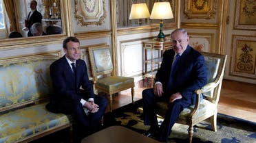 French President Emmanuel Macron speaks with Israeli Prime Minister Benjamin Netanyahu at the Elysee Palace in Paris, France December 10, 2017. (Reuters)