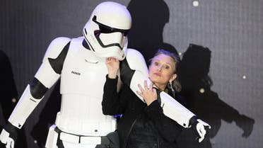 Carrie Fisher poses for cameras as she arrives at the European Premiere of Star Wars, The Force Awakens in Leicester Square, London, December 16, 2015. (Reuters)