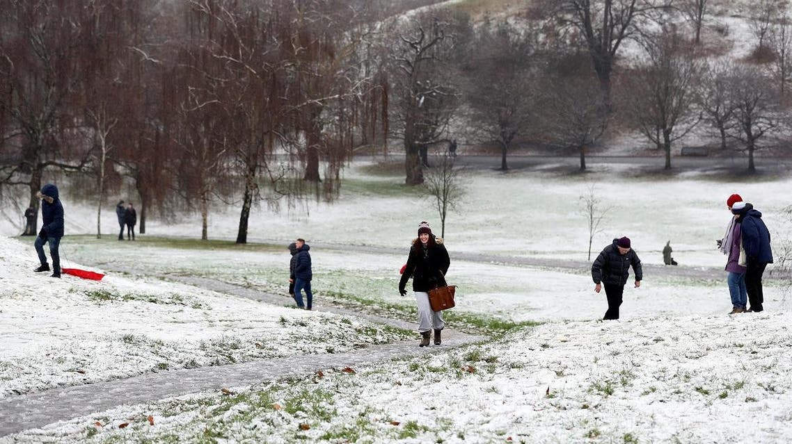 Pedestrians walk through the snow in Greenwich Park, London, Britain. (Reuters)