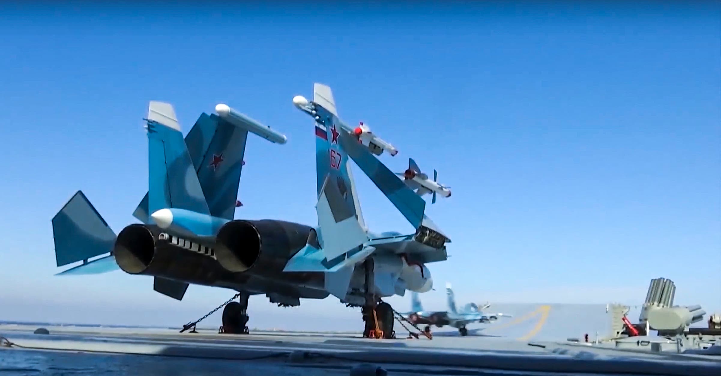In this photo made from the footage taken from Russian Defense Ministry on Nov. 15, 2016, Russian Su-33 fighter jets are parked on the flight deck of the Admiral Kuznetsov aircraft carrier in the eastern Mediterranean Sea. (AP)