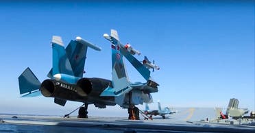 In this photo made from the footage taken from Russian Defense Ministry on Nov. 15, 2016, Russian Su-33 fighter jets are parked on the flight deck of the Admiral Kuznetsov aircraft carrier in the eastern Mediterranean Sea. (AP)