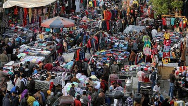 People shop at al-Ataba, a popular market in downtown Cairo, on December 12, 2017. (Reuters)