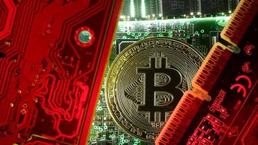  A coin representing the bitcoin cryptocurrency is seen on computer circuit boards in this illustration picture, October 26, 2017. (Reuters)