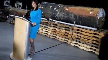 US Ambassador to the United Nations Nikki Haley briefs the media in front of remains of Iranian ‘Qiam’ ballistic missile provided by Pentagon at Joint Base Anacostia-Bolling in Washington, on December 14, 2017. (Reuters)