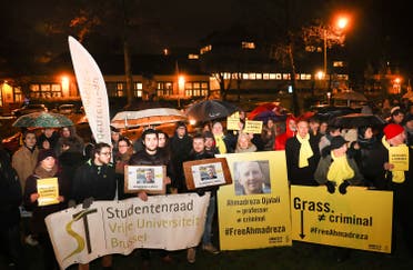A photo taken on February 13, 2017 shows a flyer during a protest outside the Iranian embassy in Brussels for Ahmadreza Djalali, an Iranian academic detained in Tehran for nearly a year and reportedly sentenced to death for espionage. (AFP)