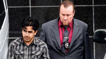 Omar Faraj Saeed Al Hardan, left, is escorted by U.S. Marshals from the Bob Casey Federal Courthouse, in Houston. (AP)