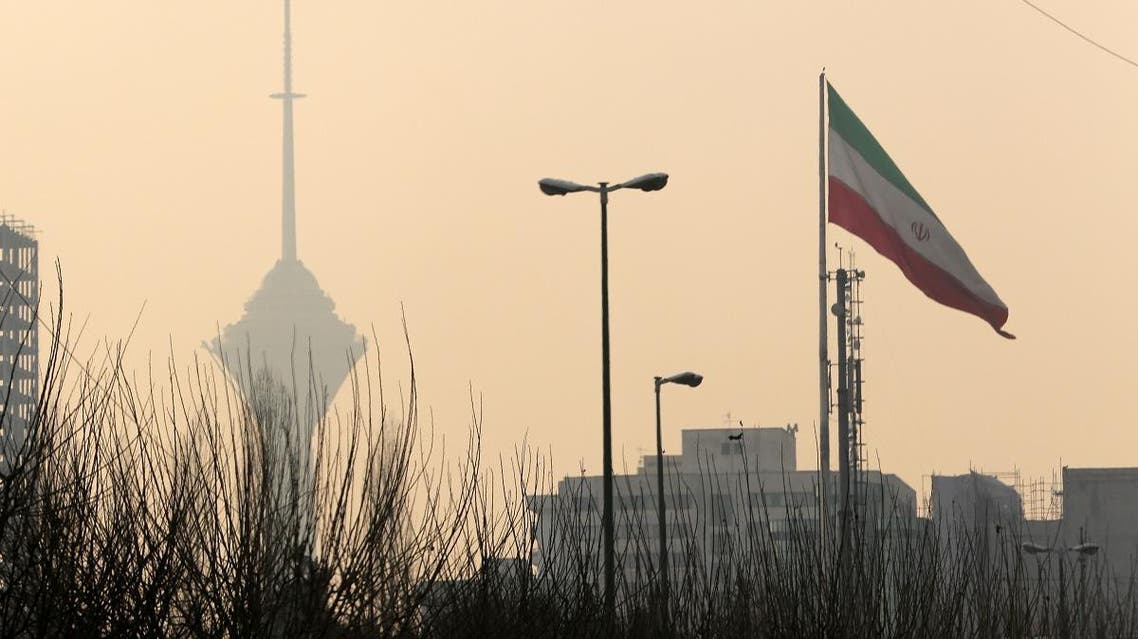 A general view of the Milad telecommunication tower (background-L) engulfed by smog in the Iranian capital Tehran on December 19, 2015. (AFP)