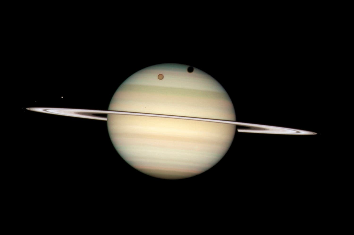 Moons of Saturn passing in front of their parent planet seen in this image taken by NASA's Hubble Space Telescope. (File photo: Reuters)