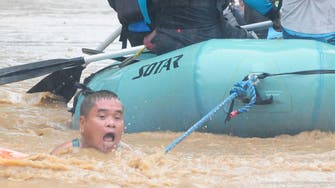 PICTURES: Death toll climbs as tropical storm crashes into Philippines