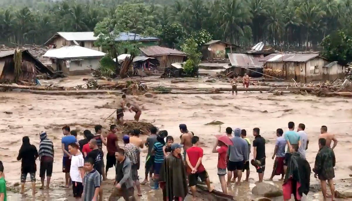 A tropical storm has unleashed flash floods and set off landslides in the southern Philippines leaving dozens of people dead. (AP)