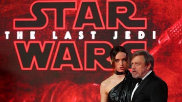 Actors Daisy Ridley and Mark Hamill pose for photographers as they arrive for the European Premiere of 'Star Wars: The Last Jedi', at the Royal Albert Hall in central London. (Reuters)