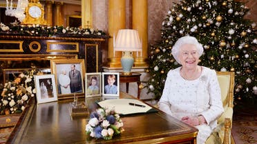 Britain's Queen Elizabeth sits at a desk in the 1844 Room at Buckingham Palace, after recording her Christmas Day broadcast to the Commonwealth, in London. (AP)