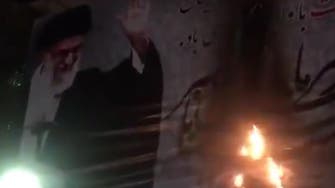 WATCH: Khamenei poster torched by Iran protesters, shots fired among crowd