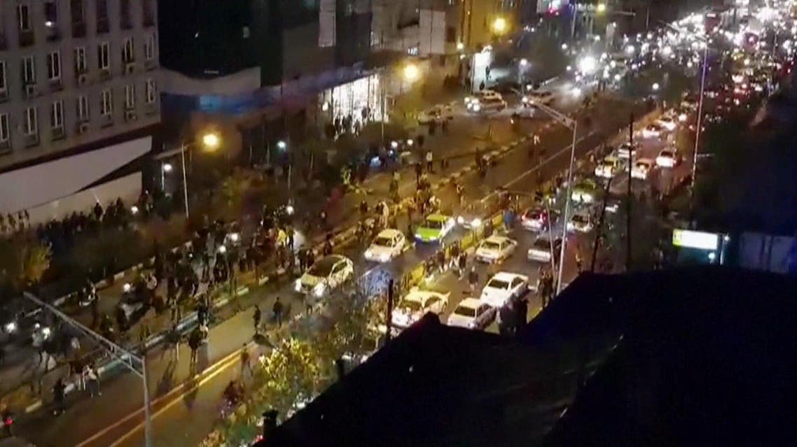 An image grab taken from a handout video released by Iran’s Mehr News agency reportedly shows a group of men walking down a street in Tehran on December 30, 2017. (AFP)