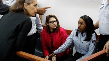 Nour Tamimi (C) in a military court at the Israeli-run Ofer prison in the West Bank village of Betunia on December 28, 2017. (AFP) 