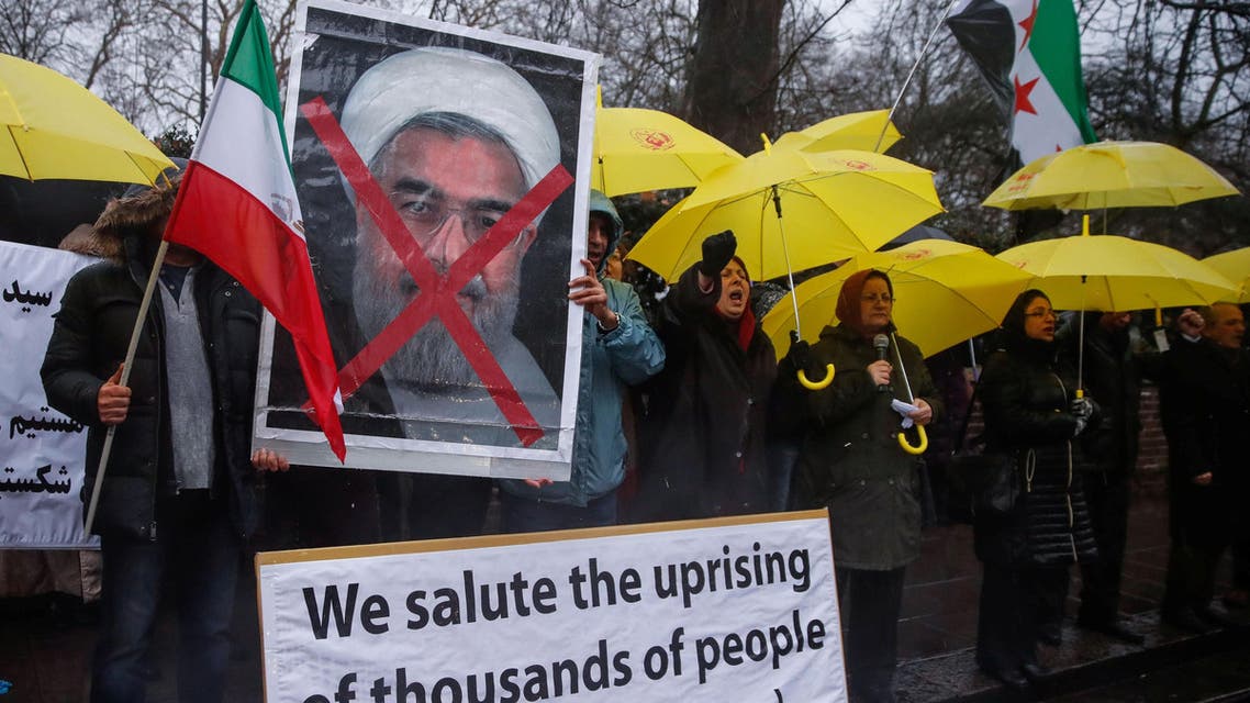 Opponents of Iranian President Hassan Rouhani hold a protest outside the Iranian embassy in west London. (Reuters)