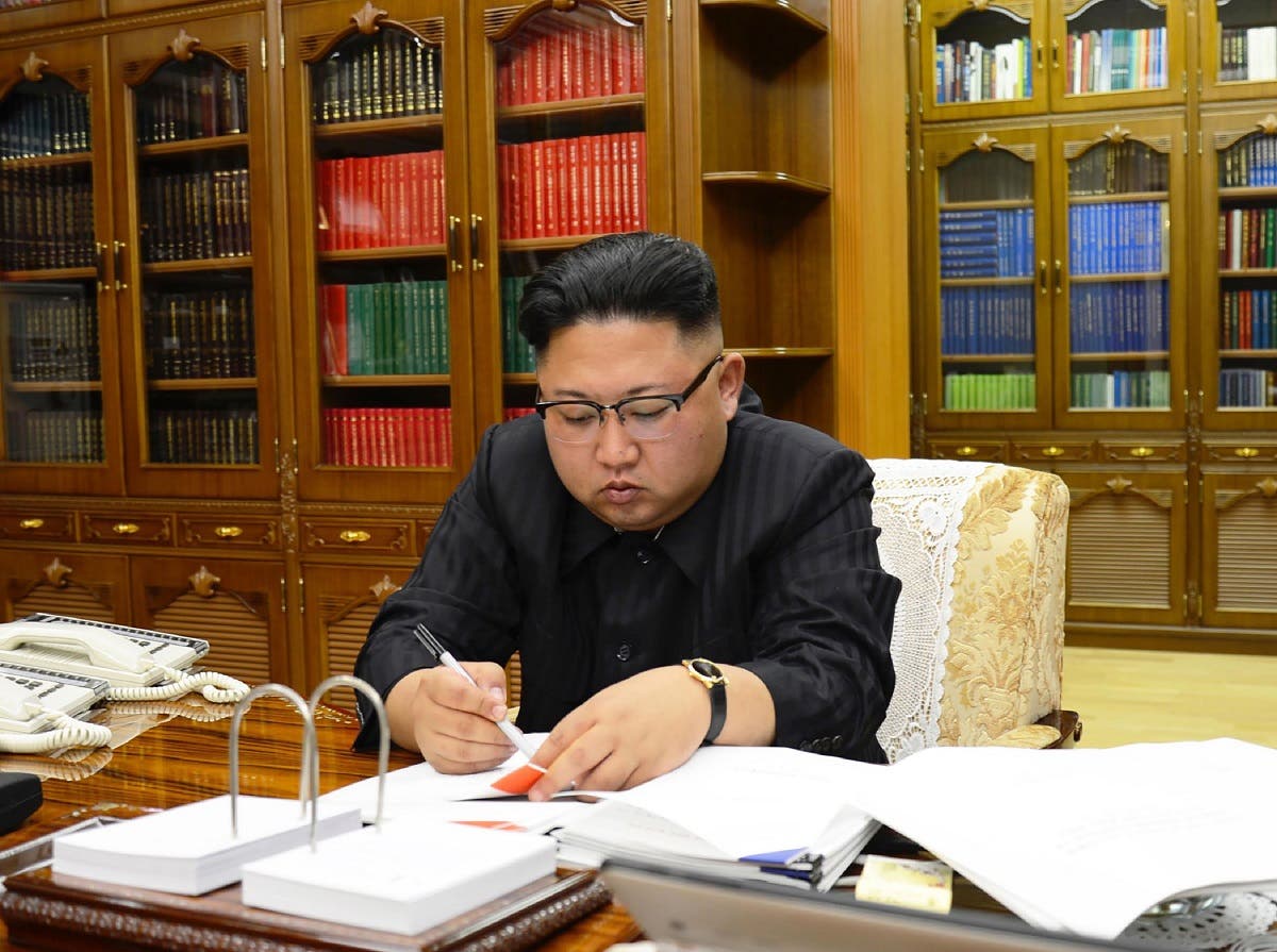 North Korean leader Kim Jong-Un signing the order to carry out the test-fire of the intercontinental ballistic missile Hwasong-14 at an undisclosed location. (AFP)