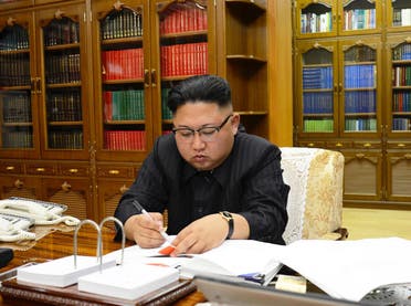 North Korean leader Kim Jong-Un signing the order to carry out the test-fire of the intercontinental ballistic missile Hwasong-14 at an undisclosed location. (AFP)