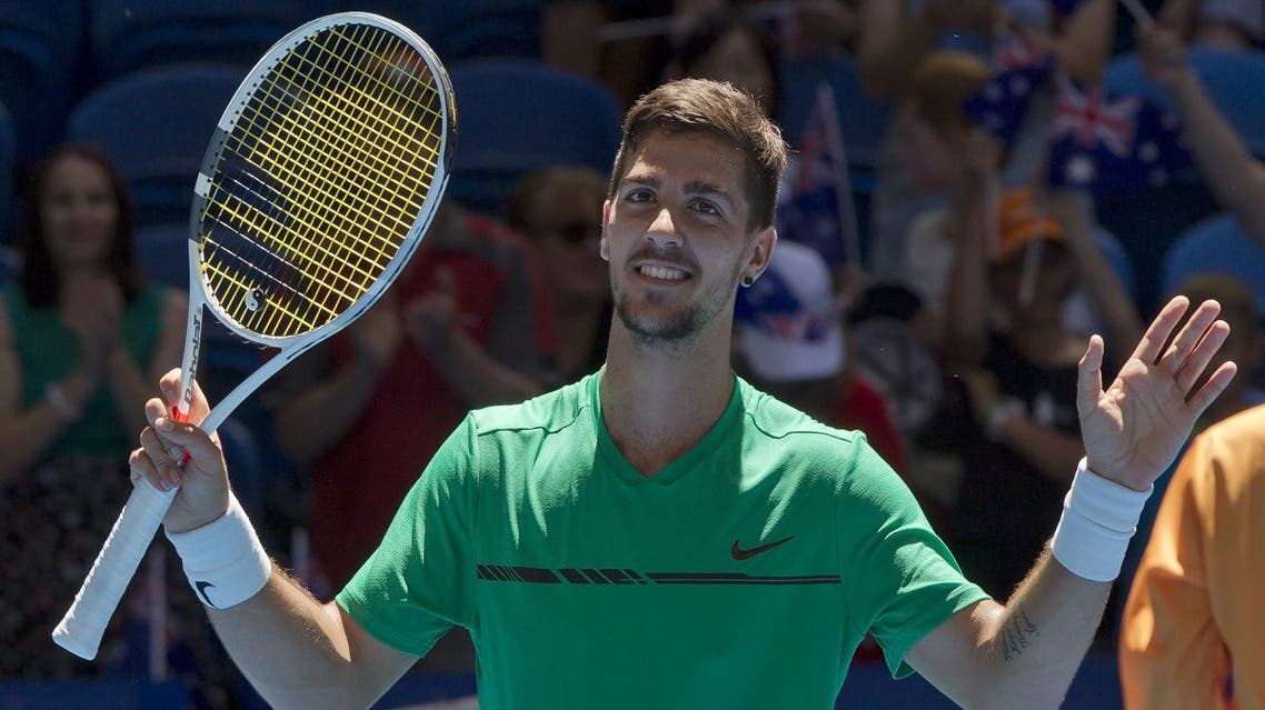 Thanasi Kokkinakis of Australia celebrates his victory over Vasek Pospisil of Canada in their third session men's singles match on day two of the Hopman Cup. (AFP)