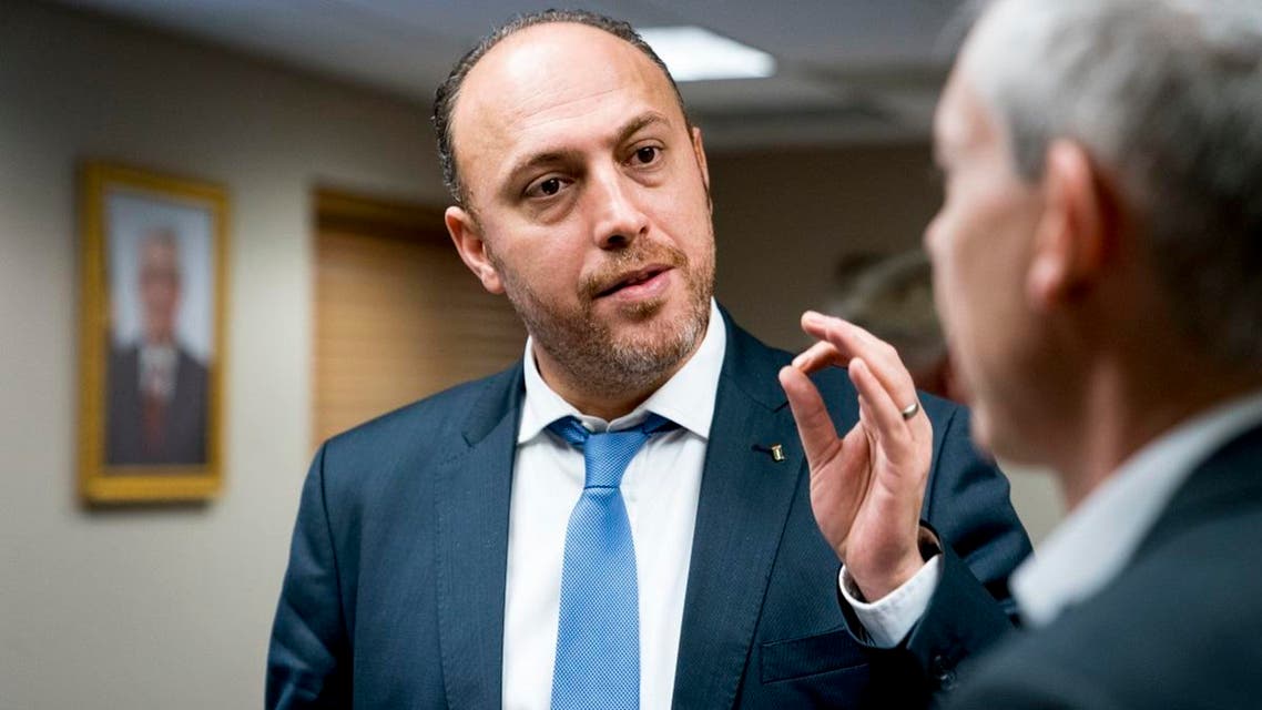 Palestinian General Delegation head Husam Zomlot speaks to a reporter before an interview with the Associated Press at the Washington office of the Palestine Liberation Organization, Tuesday, Dec. 5, 2017. (AP)