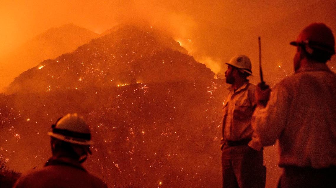 firefighters monitor the Thomas fire as it burns through Los Padres National Forest near Ojai, Calif. (AP)