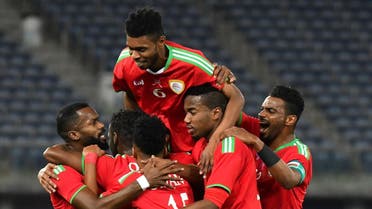 Oman's players celebrate after scoring a goal during the 2017 Gulf Cup of Nations semi-final football match between Oman and Bahrain. (AFP)