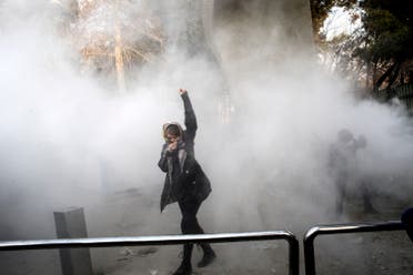 A university student being tear-gassed at a protest in Tehran University. December 30, 2017. (AP)