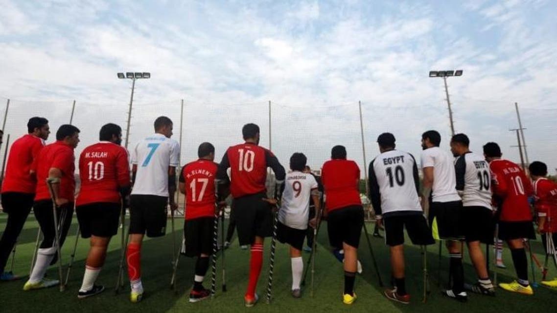 Members of "Miracle Team", a soccer team made up of one-legged, crutch-bearing soccer players, listen to their coach before a training session at El Salam club on the outskirts of Cairo, Egypt December 29, 2017. (Reuters)