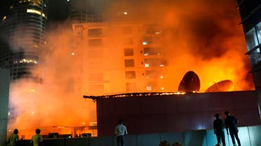 People watch as a huge fire engulfs a rooftop restaurant in Mumbai, India, on Dec. 29, 2017. (File photo: AP)