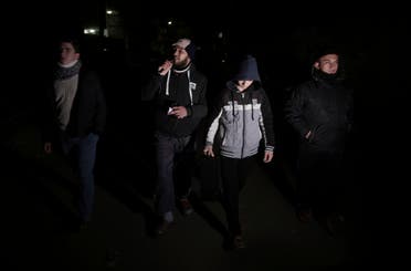 In this Wednesday, Jan. 3, 2018 photo, Palestinian volunteers walk use loadspeakers to call people to wake up for the dawn prayer, in Gaza City. (AP)