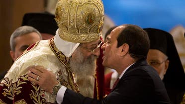 Last year on the eve of Coptic Christmas, Egypt’s President Abdel-Fattah el-Sissi, greets Coptic Pope Tawadros II at St. Mark's Cathedral, in Cairo. (AP)