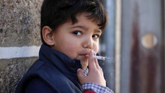 Children in Portuguese village encouraged to smoke to mark Christian festival