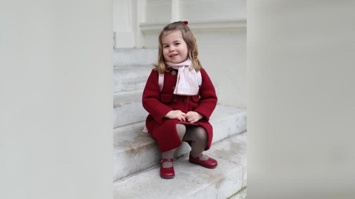 Britain's Princess Charlotte sits on the steps at Kensington Palace in a photograph taken taken by her mother Reuters