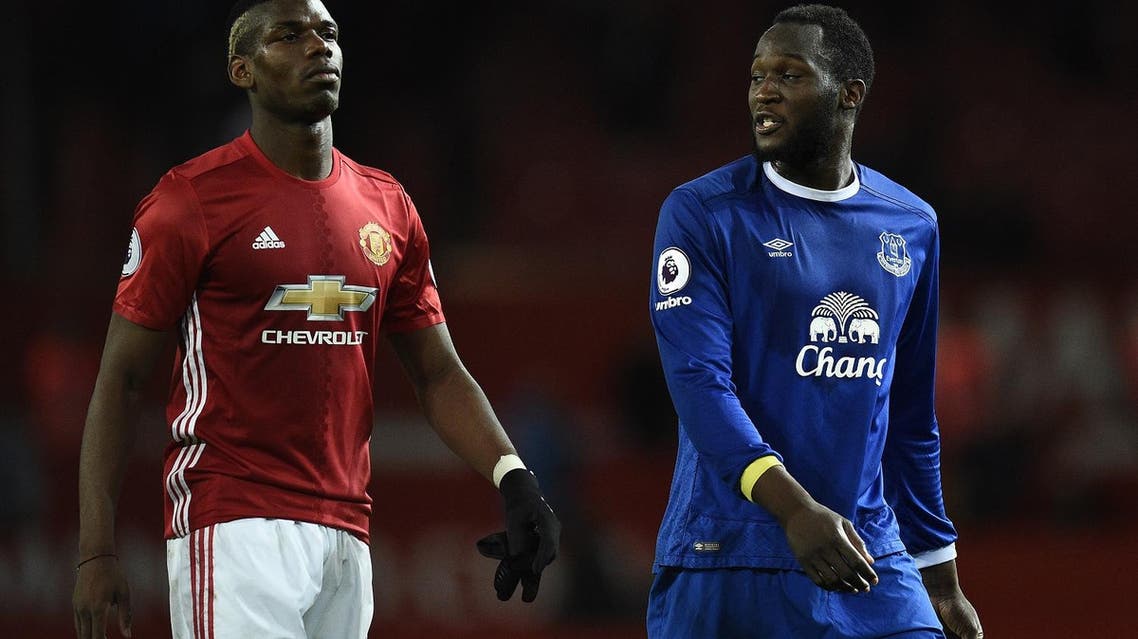 Fle photo of Manchester United’s French midfielder Paul Pogba (L) and Everton’s Belgian striker Romelu Lukaku leave the pitch following the English Premier League football match on April 4, 2017. The match ended in a draw at 1-1. (AFP)