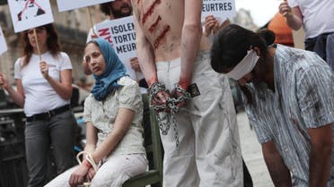 Reporters Without Borders activists take part in a protest in Paris, on July 10, 2012 to denounce journalists’ imprisonment in Iran. (AFP)