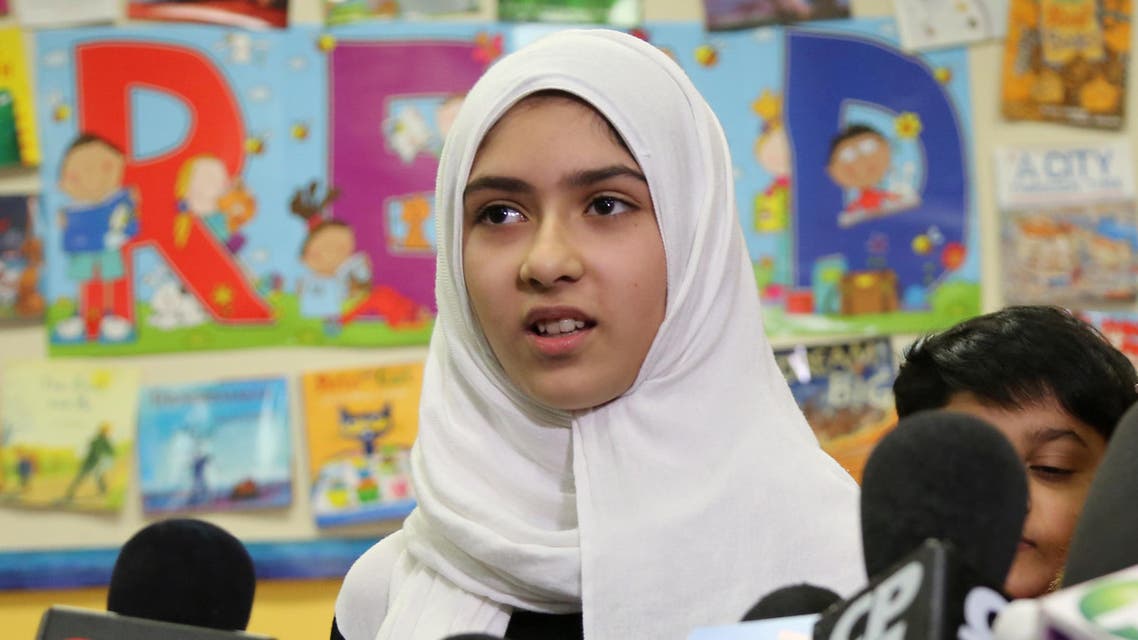 Khawlah Noman, 11, speaks to reporters after she told police that a man cut her hijab with scissors in Toronto on January 12, 2018. (Reuters)