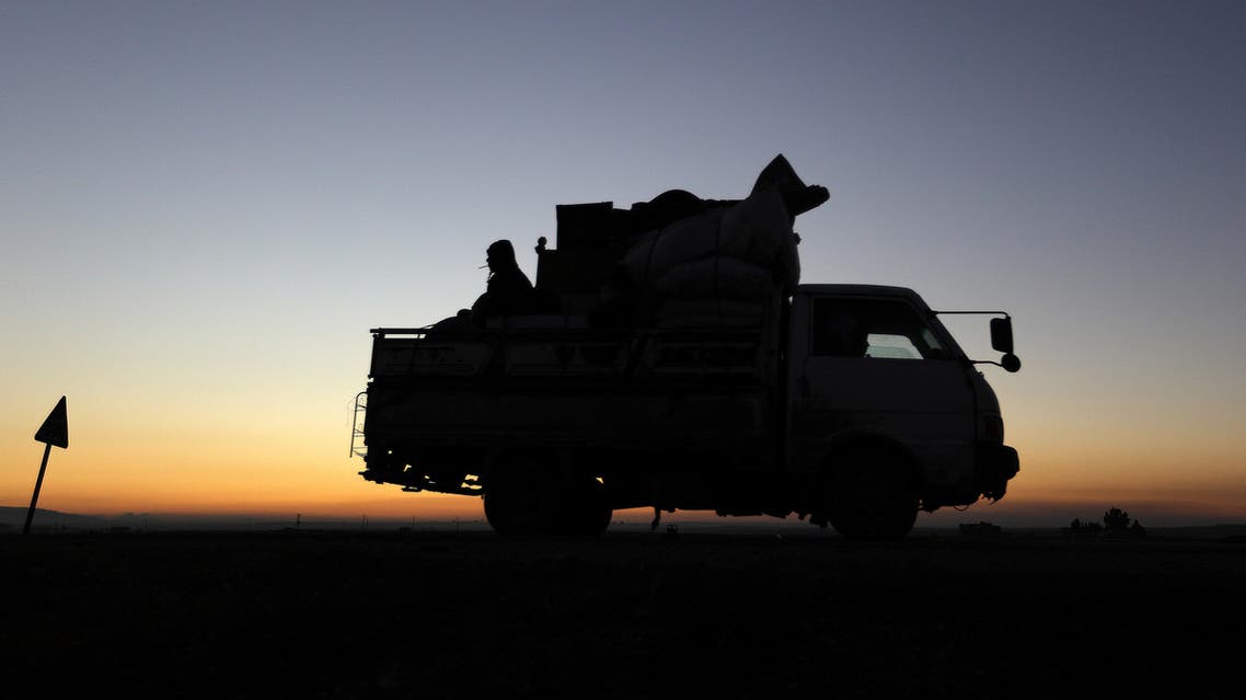 Displaced Syrians who fled the fighting in Idlib province's southeastern town of Sinjar drive on a road in a rebel-held area near the city of Saraqib on January 7, 2018. Syrian troops captured Sinjar, the "biggest town in southeast Idlib", from Syria's former Al-Qaeda affiliate and were within 14 kilometres (9 miles) of the Abu al-Duhur military base, the British-based Syrian Observatory for Human Rights said. OMAR HAJ KADOUR / AFP