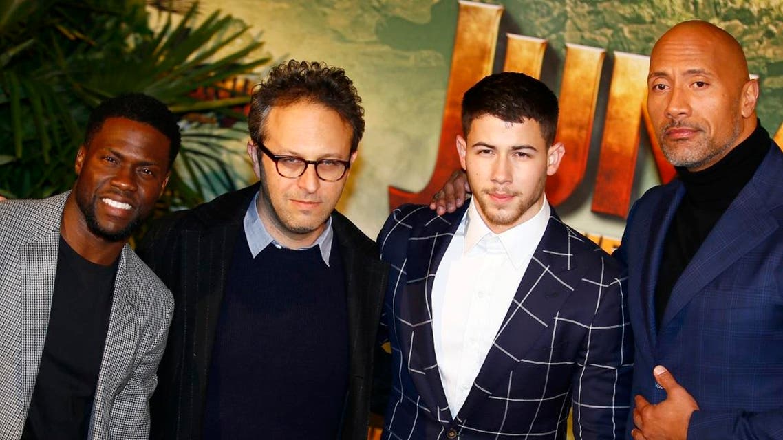 US Director Jake Kasdan, second left, poses with Jumanji actors, Kevin Hart, Nick Jonas and Dwayne Johnson. (AP)