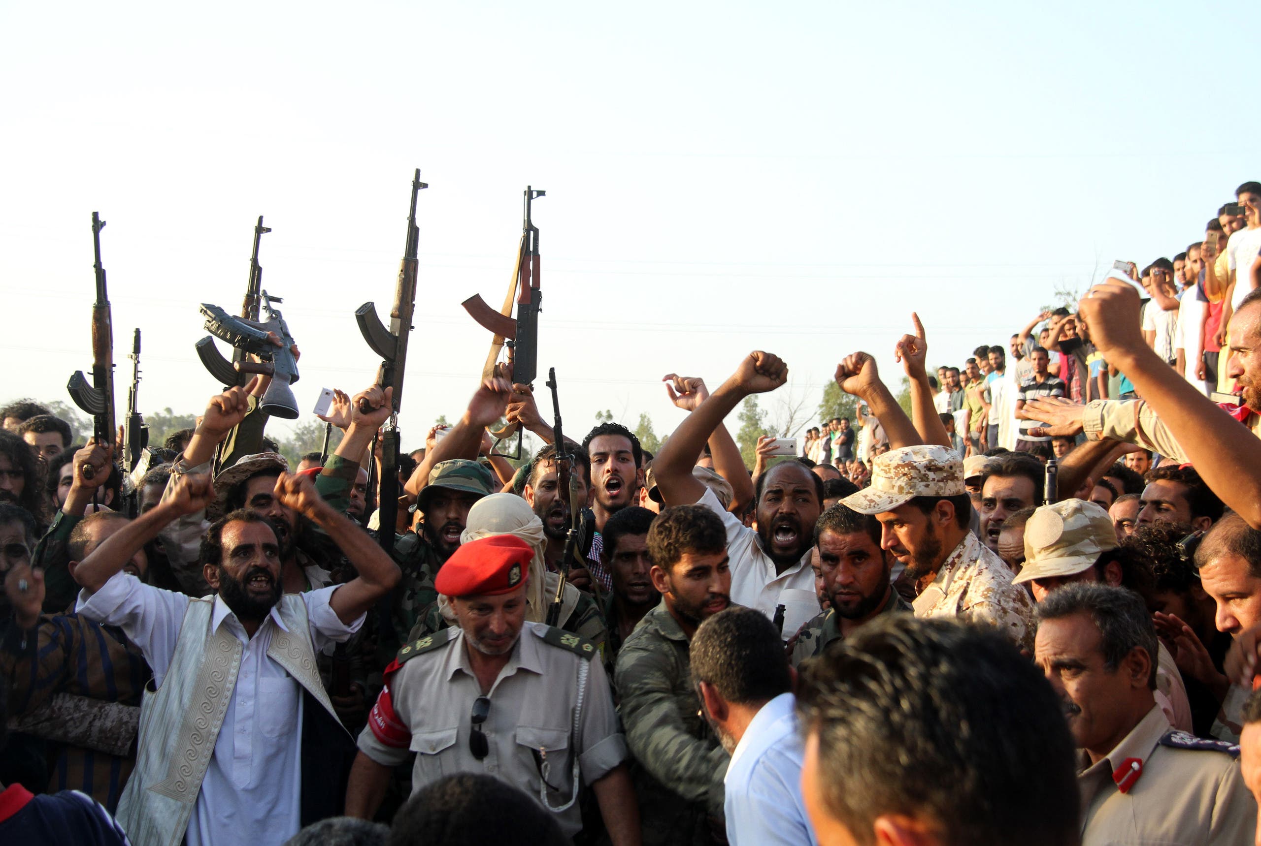 Libyans attend a funeral in city of Surman, some 80 km west of Tripoli on August 24, 2017, of some of the people that were beheaded in an attack claimed by ISIS. (AFP)