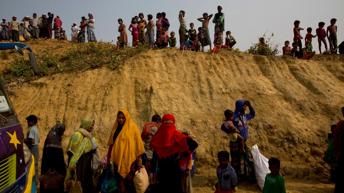 Rohingya Muslims watch from atop a hill as new refugees arrive in Balukhali refugee camp, 50 km from Cox’s Bazar, Bangladesh, on Jan. 14, 2018. (AP)