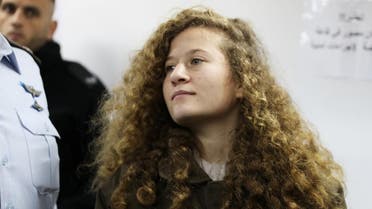 Palestinian teen Ahed Tamimi enters a military courtroom at Ofer Prison, near the West Bank city of Ramallah. (Reuters)