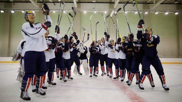 Members of South Korean national ice hockey team pose for photographs after a training session in Jincheon. (Reuters)