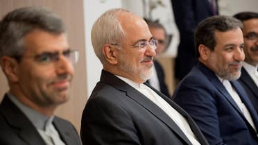 Iran Foreign minister Mohammad Javad Zarif looks with representative of the European Union for Foreign Affairs in Brussels on January 11, 2018. (AFP)