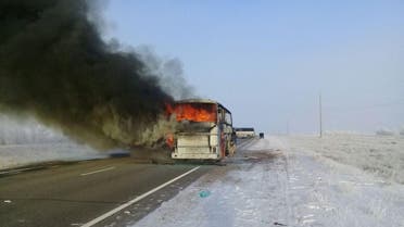 A view shows a burning bus on a route used by migrant workers heading to Russia, in the Aktobe region, Kazakhstan January 18, 2018. The Committee for Emergency Situations of the Ministry of Internal Affairs of the Republic of Kazakhstan/Handout via REUTERS ATTENTION EDITORS - THIS IMAGE WAS PROVIDED BY A THIRD PARTY. NO RESALES. NO ARCHIVES.